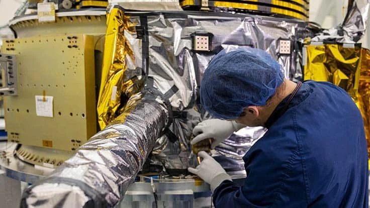 An L3Harris engineer works on the Navigation Technology Satellite-3 (NTS-3), a U.S. Air Force vanguard program that will examine ways to augment the military’s positioning, navigation, and timing capabilities.